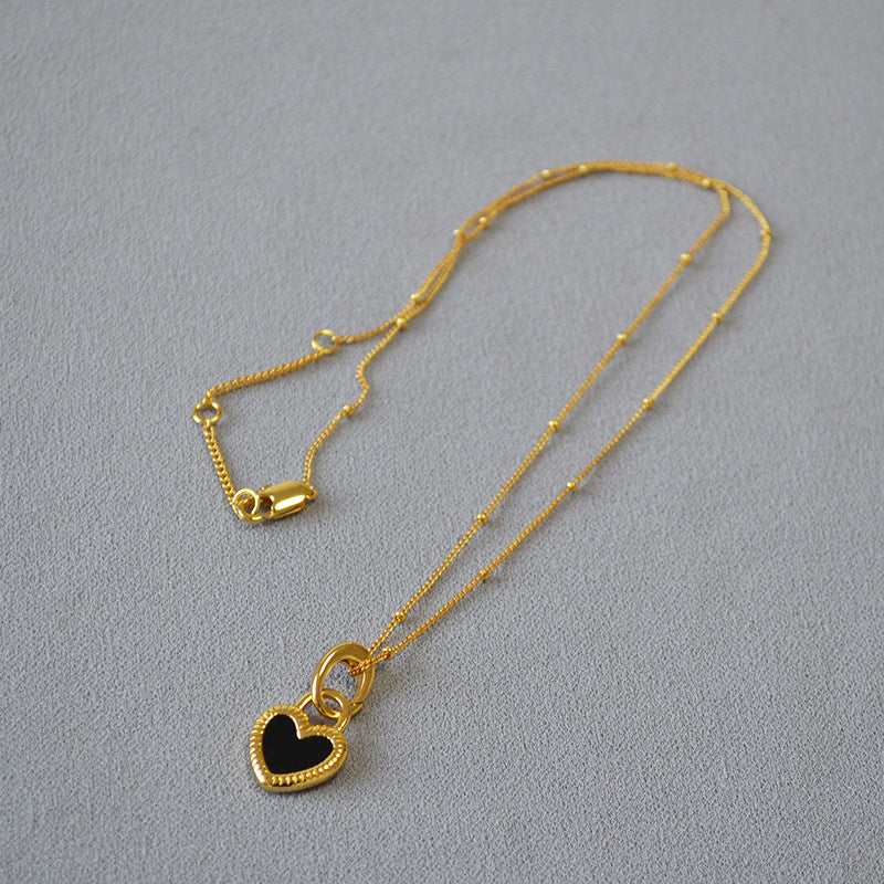 Black And White Heart Pendant Necklace In Gold
